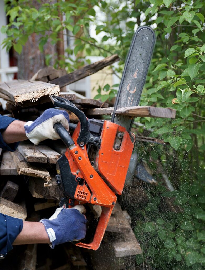 A chainsaw being used on a small board